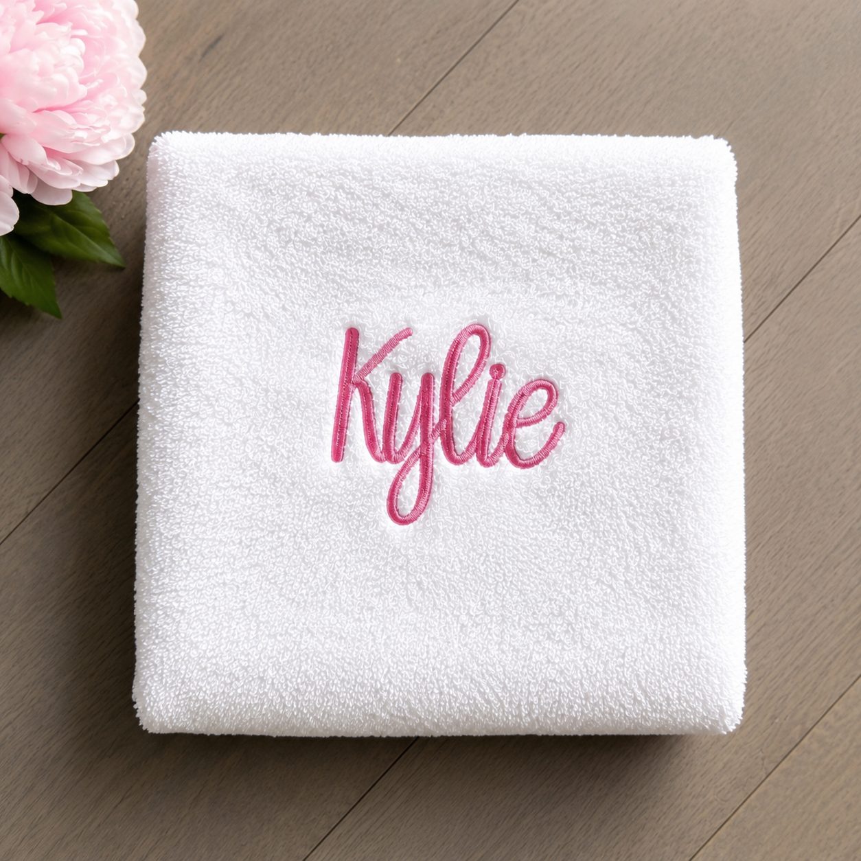 Towel with custom script name embroidery